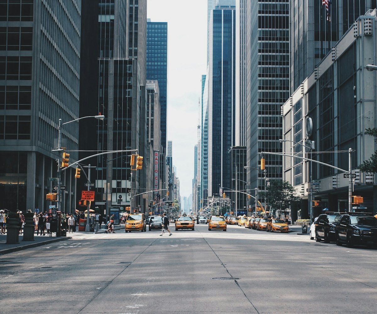 Busy avenue between skyscrapers in a major international city