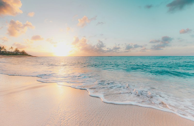 Sunrise over a calm tropical beach