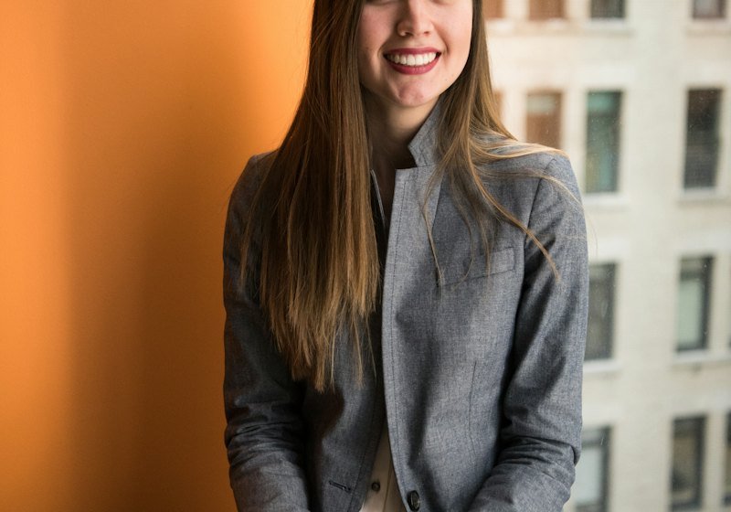 Confident professional woman smiling in a modern office