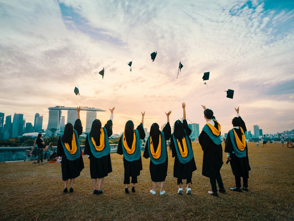 Graduates throwing caps into the air at a graduation ceremony